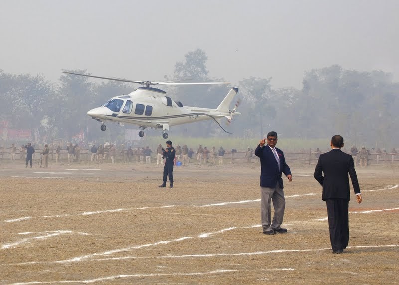 Helicopter carrying Lama Zopa Rinpoche landing at Kushinagar, India, December 13, 2013. Photo by Andy Melnic.