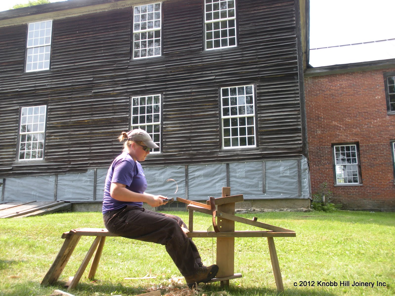 A Yestermorrow student shapes a peg at the Theron Boyd house.