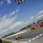 Fernando Alonso, Ferrari F138 crosses finish line.