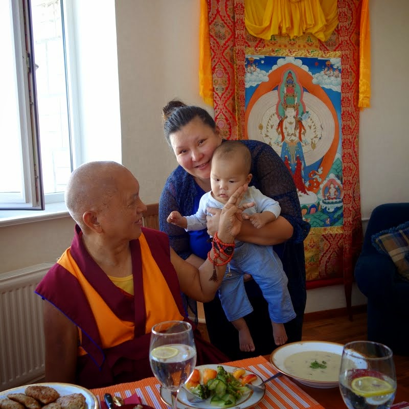 Lama Zopa Rinpoche blessing baby, Ulaanbaatar, Mongolia, August 2014. Photo by Ven. Roger Kunsang.
