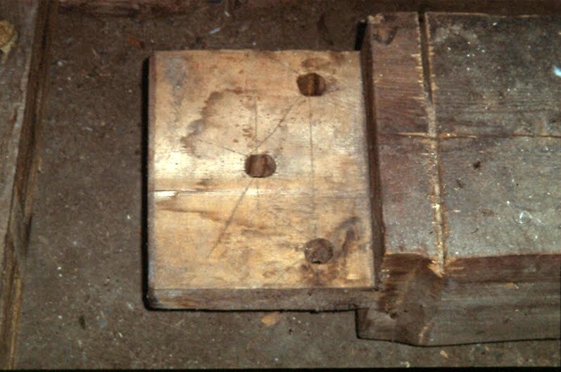 Tie beam end showing drawbore layout marks.