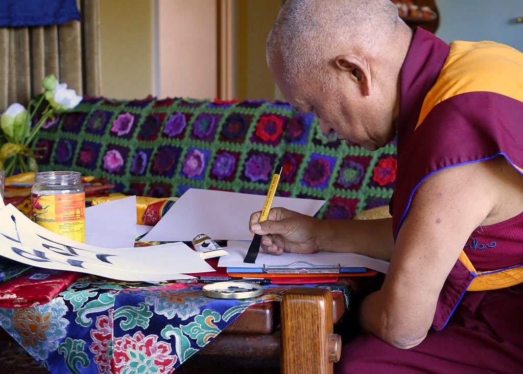 Lama Zopa Rinpoche practicing calligraphy in his room at Thubten Shedrup Ling, Bendigo, Australia, October 2014. Photo by Ven. Roger Kunsang.