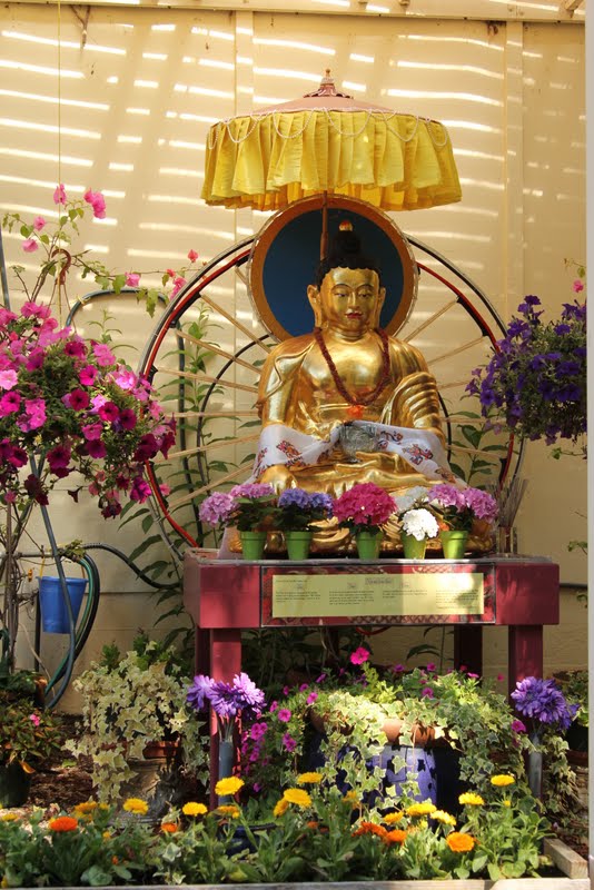 Buddha and flower offerings at Kachoe Dechen Ling