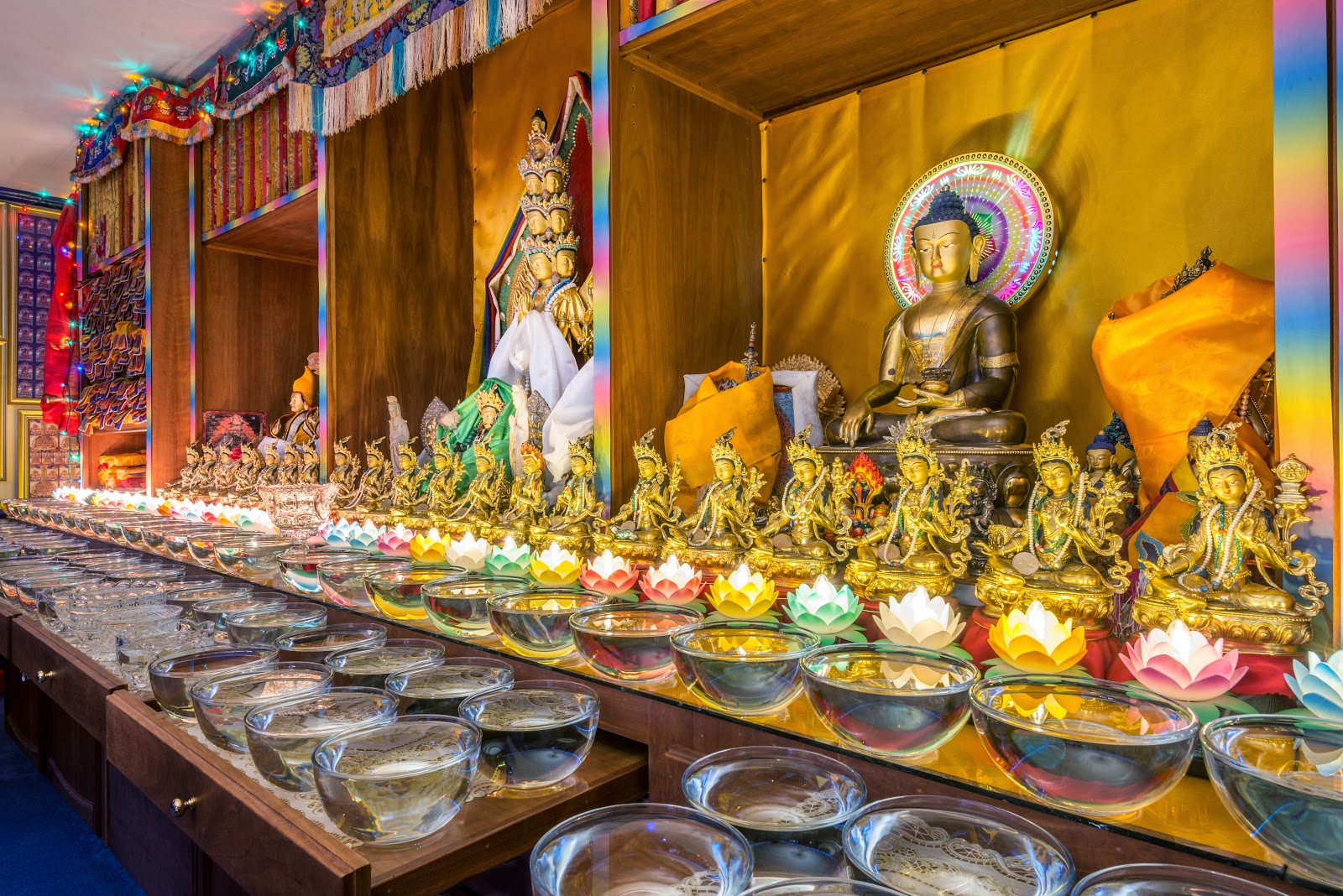 Holy objects and extensive offerings at Kachoe Dechen Ling. Photo by Chris Majors.