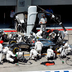 Kevin Magnussen makes a pit stop for McLaren