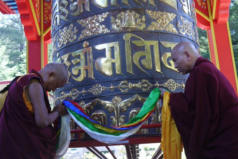 Lama Zopa Rinpoche consecrating the finished large prayer wheel at Land of Medicine Buddha.