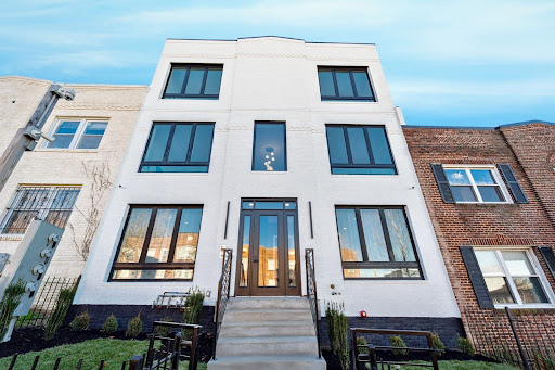 Modern white facade with large windows in this luxury apartment / penthouse for sale in Washington ($699,000)
