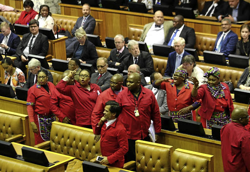 THEY WON'T SHUT UPThe EFF leaves the National Assembly during the medium-term Budget speech of Finance Minister Malusi Gigaba at parliament in Cape Town.