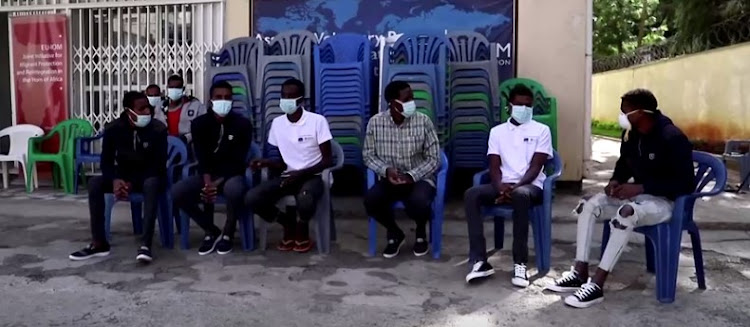 Ethiopian migrants sitting outside a migrant centre in Addis Ababa, Ethiopia, describe the horror of listening to 64 of their friends and relatives suffocating to death in the back of a truck in Mozambique in March.