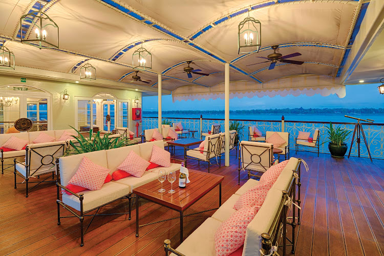 Watch the passing landscapes from the Observation Lounge aboard Mekong Navigator. 