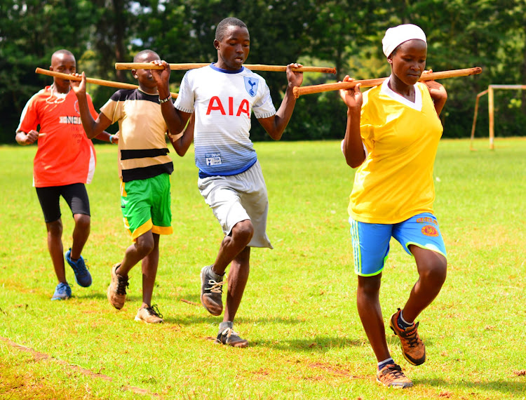 Grace Gathoni leads fellow walkers during a training session at Ihururu Stadium, Nyeri on December 15