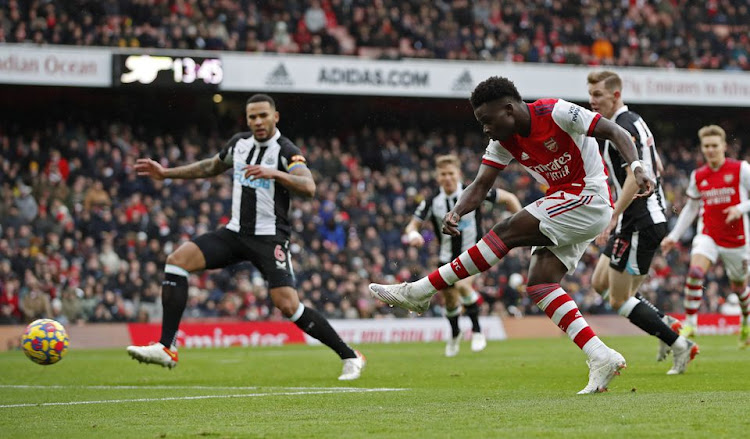 Soccer Football - Premier League - Arsenal v Newcastle United - Emirates Stadium, London, Britain - November 27, 2021 Arsenal's Bukayo Saka scores their first goal Action Images via Reuters/Paul Childs