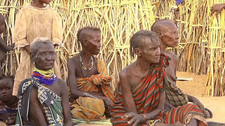 Kang'irisai residents stricken with hunger await relief food.