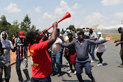 Striking Clover workers sing struggle songs. File photo.