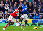 Arsenal's Thomas Partey and Everton's Abdoulaye Doucoure (right) battle for the ball during the Premier League match at Goodison Park, Liverpool. 