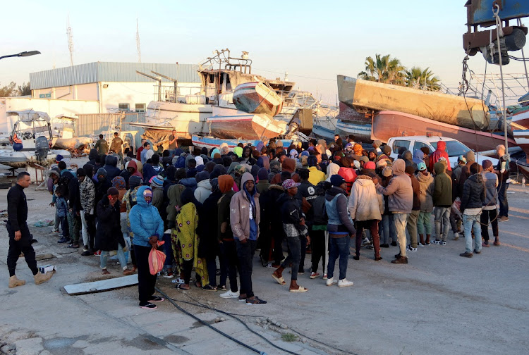 Migrants in the Tunisian port of Sfax after being stopped at sea by the country's coast guard during an attempt to cross to Italy in April 2023.