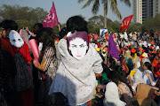 Protesters wore masks depicting Qandeel Baloch, a Pakistani social media celebrity who according to police was strangled in what appeared to be an 