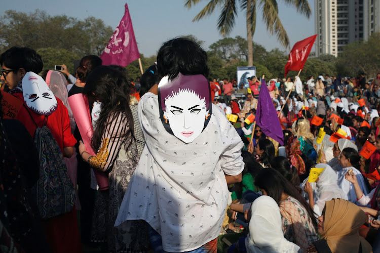 Protesters wore masks depicting Qandeel Baloch, a Pakistani social media celebrity who according to police was strangled in what appeared to be an "honour killing" in 2016, in Karachi, Pakistan.