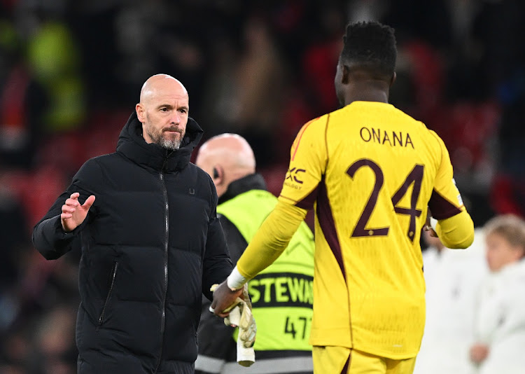 Manchester United manager Erik ten Hag with his goalkeeper Andre Onana after their team's defeat in the UEFA Champions League match to Bayern München at Old Trafford on December 12, 2023 in Manchester