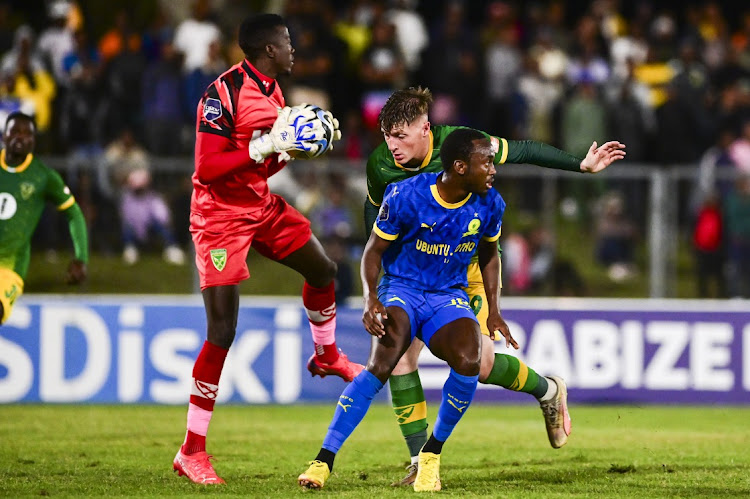 Lamontville Golden Arrows goalkeeper Ismail Watenga collects while teammate Bradley Cross challenges Peter Shalulile of Mamelodi Sundowns in the DStv Premiership match at Mpumalanga Stadium in Hammarsdale on Wednesday night.