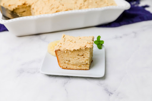 A slice of Easy Peanut Butter Cake & Peanut Butter Frosting on a plate.