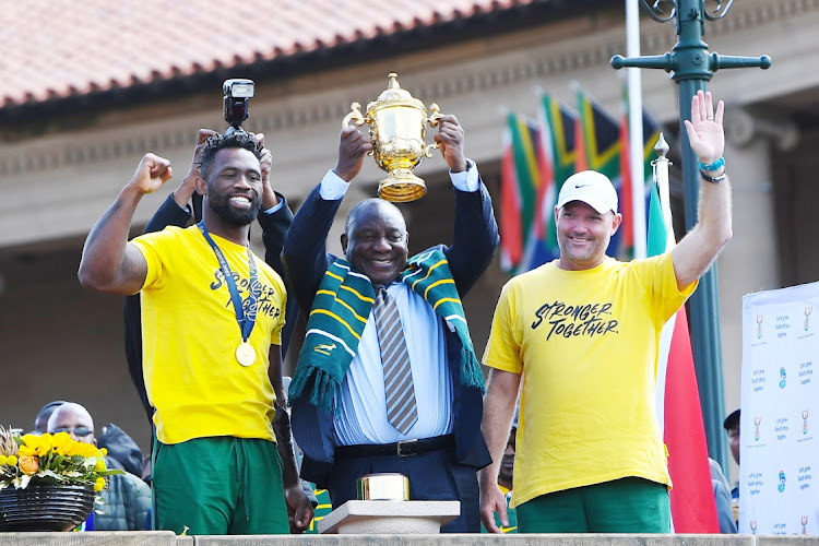 Sringbok captain Siya Kolisi ,President Cyril Ramaphosa and Springbok coach Jacques Nienaber lift the trophy during the Trophy Tour in Pretoria at Union Buildings on Thursday