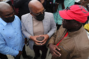 Home affairs minister Aaron Motsoaledi during a visit to Diepsloot last week. President Cyril Ramaphosa says the government is focusing on enforcing migration laws, boosting police numbers and re-establishing community policing forums across the country.