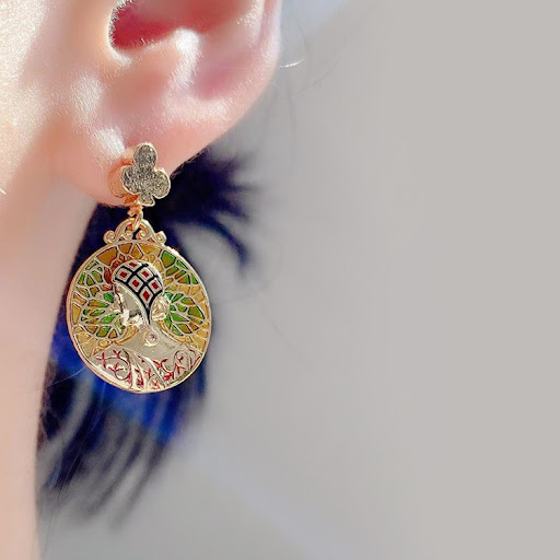 Title 2, Embossed portrait enamel drip glazed green earr...