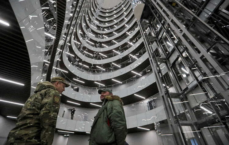 Men talk inside the PMC Wagner Centre, which is a project implemented by Wagner private military group founder Yevgeny Prigozhin, in Saint Petersburg, Russia. File photo:Picture: IGOR RUSSAK/REUTERS