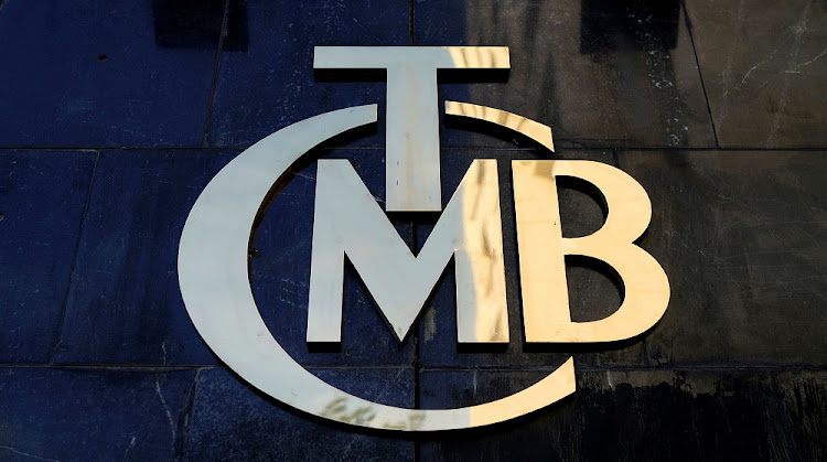 A logo of Turkey's Central Bank (TCMB) is pictured at the entrance of the bank's headquarters in Ankara, Turkey. REUTERS/UMIT BEKTAS