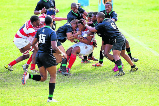 Cambridge and Hudson Park first team players collide during their hotly contested FNB Classic Clash held at Cambridge High School on Saturday afternoon. Hudson edged the match 14-9.