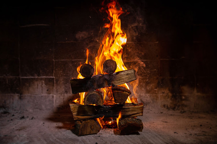 Firstly you need to place your (dry) wood in a tower shape, like a rough Jenga puzzle; two pieces at the bottom, two pieces across and so on.