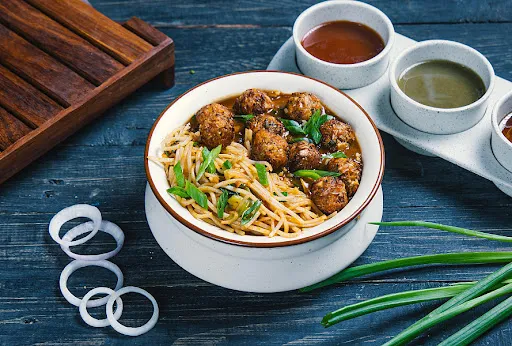 Herbs In Noodles With Manchurian Balls