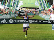 David Gatebe, wins of the Men's 56km race during the Old Mutual Two Oceans Marathon on March 30, 2013 in Cape Town, South Africa. 