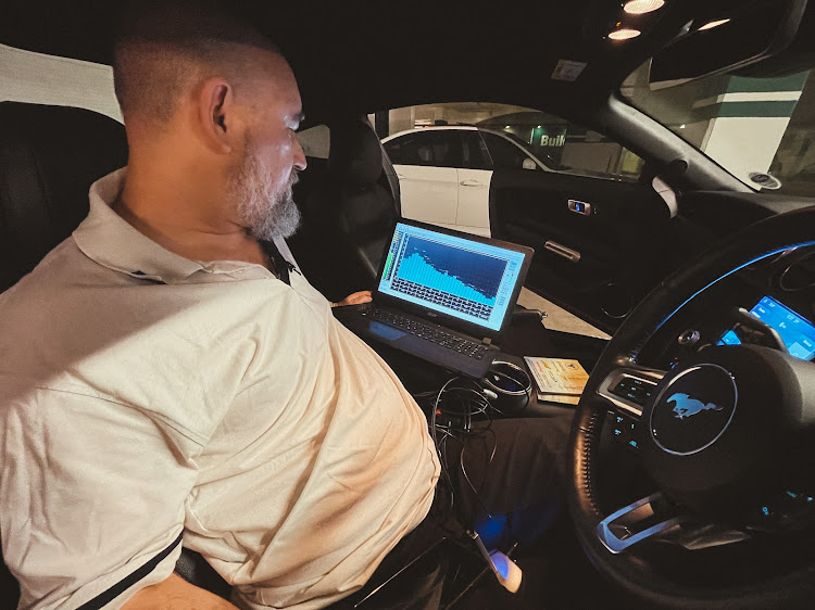 Joel Kopping using his realtime analyser inside the cabin of the Ford Mustang GT California Special.