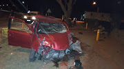 The wrecked car on the pavement outside the St Andrew's College school chapel.