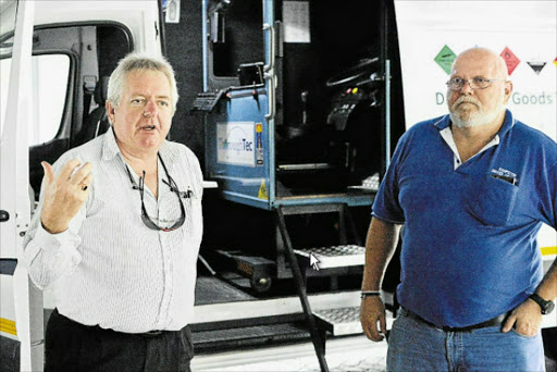 INNOVATIVE: George Murdoch and Rick Andrew, with the mobile cybertruck simulator in East London Picture: RANDELL ROSKRUGE