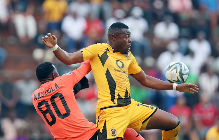 Richards Bay goalkeeper Salim Magoola challenges by Ranga Chivaviro of Kaizer Chiefs in the DStv Premiership match at the King Zwelithini Stadium in Umlazi, Durban on Sunday.