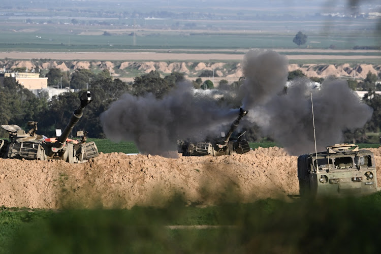 An Israeli mobile artillery unit fires towards Gaza. Picture: DYLAN MARTINEZ