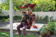 Top rock climber Gosia Lipinska does pull-ups with her toddlers under lockdown