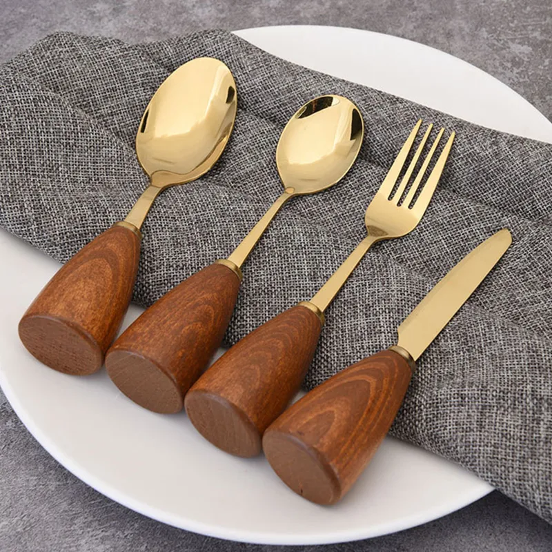 Conjunto de talheres luxuoso com cabo de madeira e aço inoxidável. Fofo e leve, inclui faca, garfo e colher, ideal para sua mesa.