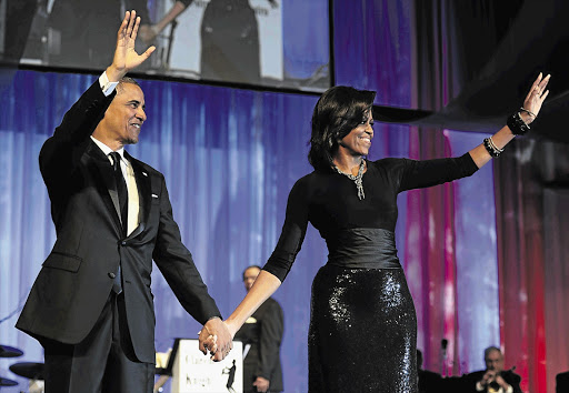 US President Barack Obama and his wife, Michelle, arrive at the Congressional Black Caucus Foundation's annual awards dinner in Washington on Saturday Picture: MIKE THEILER/REUTERS