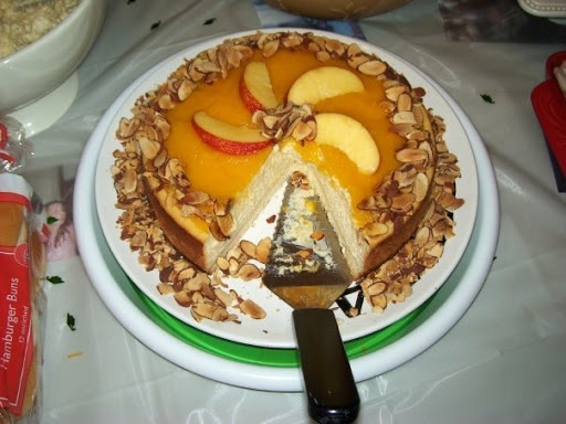 Amaretto peach cheesecake with a shortbread crust and toasted sliced almonds. 