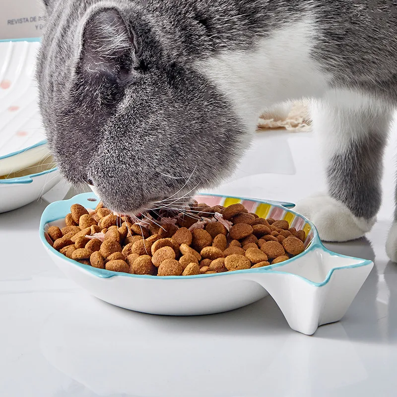 Fish-shaped ceramic cat food feeding bowl. Stylish and functional plate for your feline friend. Encourages healthy eatin