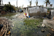 A child stands among pools of stagnant water in Beira, Mozambique, on March 27 2019. Five cases of cholera have been reported so far in Mozambique in the wake of the cyclone.
