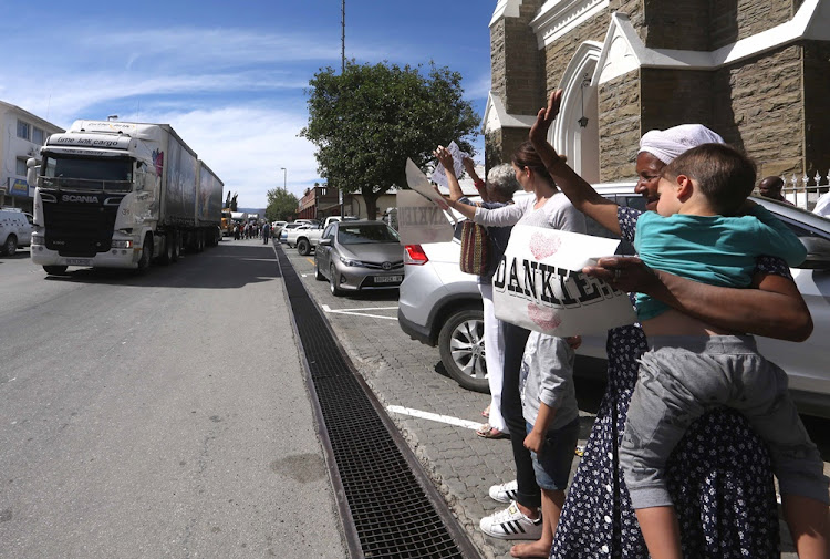 People of Beaufort West welcome the farmers of Mpumalanga who organised a mass convoy to deliver 1500 animal feed bales to the drought-stricken Karoo town on November 08, 2017.