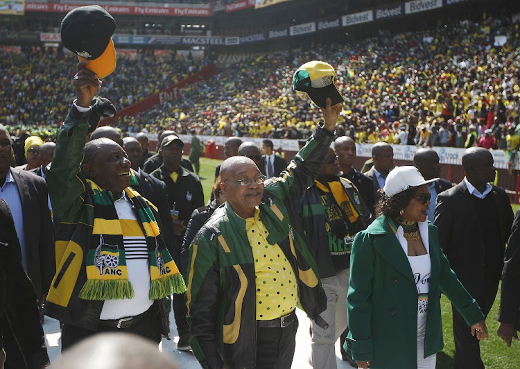 Former president Jacob Zuma and President Cyril Ramaphosa arrive at the ANC Siyanqoba Rally at Ellis Park stadium in Johannesburg on July 31, 2016.