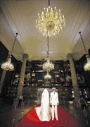 The wedding dress and uniform worn at the wedding of Prince Albert and Charlene Wittstock are displayed at the Oceanographic Museum of Monaco Picture: REUTERS