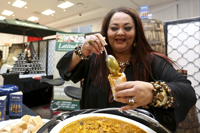 Actress Shaleen Surtie-Richards filling a mini bunny chow.