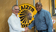 Kaizer Chiefs' chairman Kaizer Motaung (R) shakes hands and pose for a picture with the newly appointed technical advisor Rob Hutting (L) on Tuesday 9 January 2018.